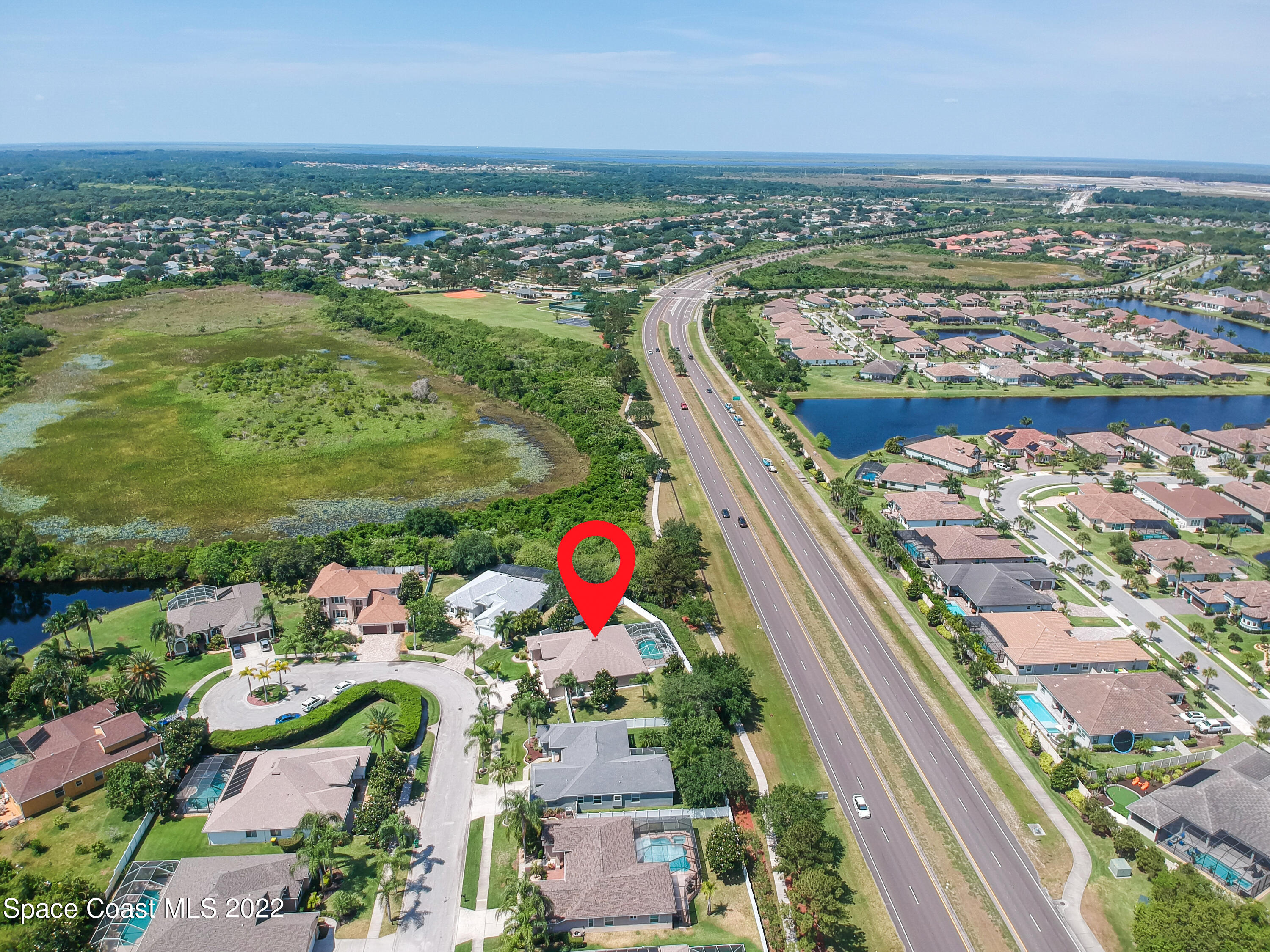 3832 Stream Drive Melbourne, FL 32940 - Photo 62 of 63 an aerial view of residential houses with outdoor space