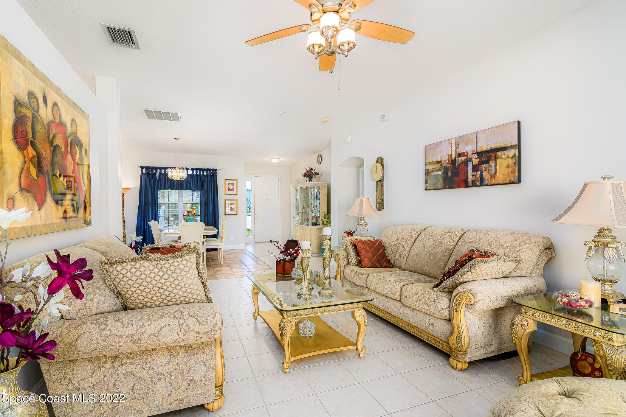 3832 Stream Drive Melbourne, FL 32940 - Photo 8 of 63 a living room with furniture and a chandelier