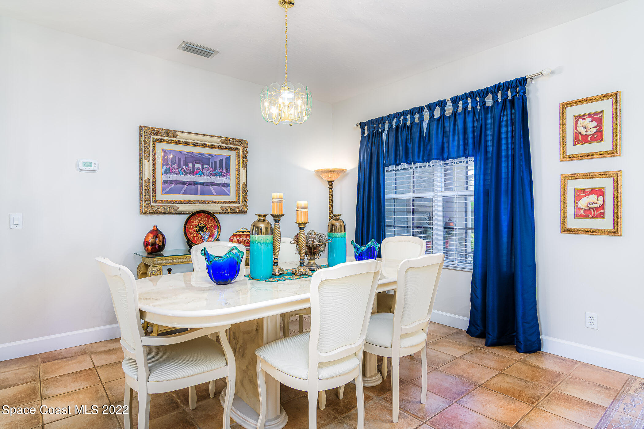 3832 Stream Drive Melbourne, FL 32940 - Photo 10 of 63 a dining room with furniture and window