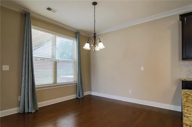 a view of a room with window wooden floor and a ceiling fan