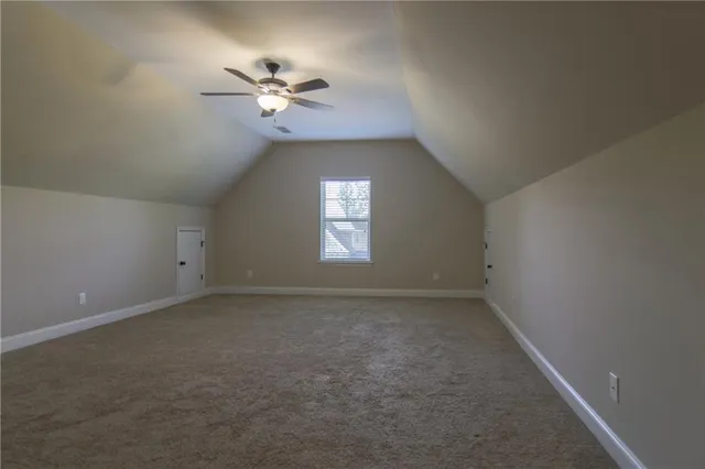 a view of a ceiling fan and a window