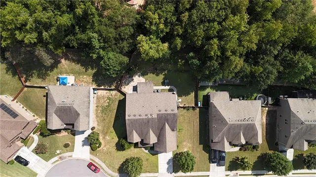 a front view of a house with a yard garage and outdoor seating