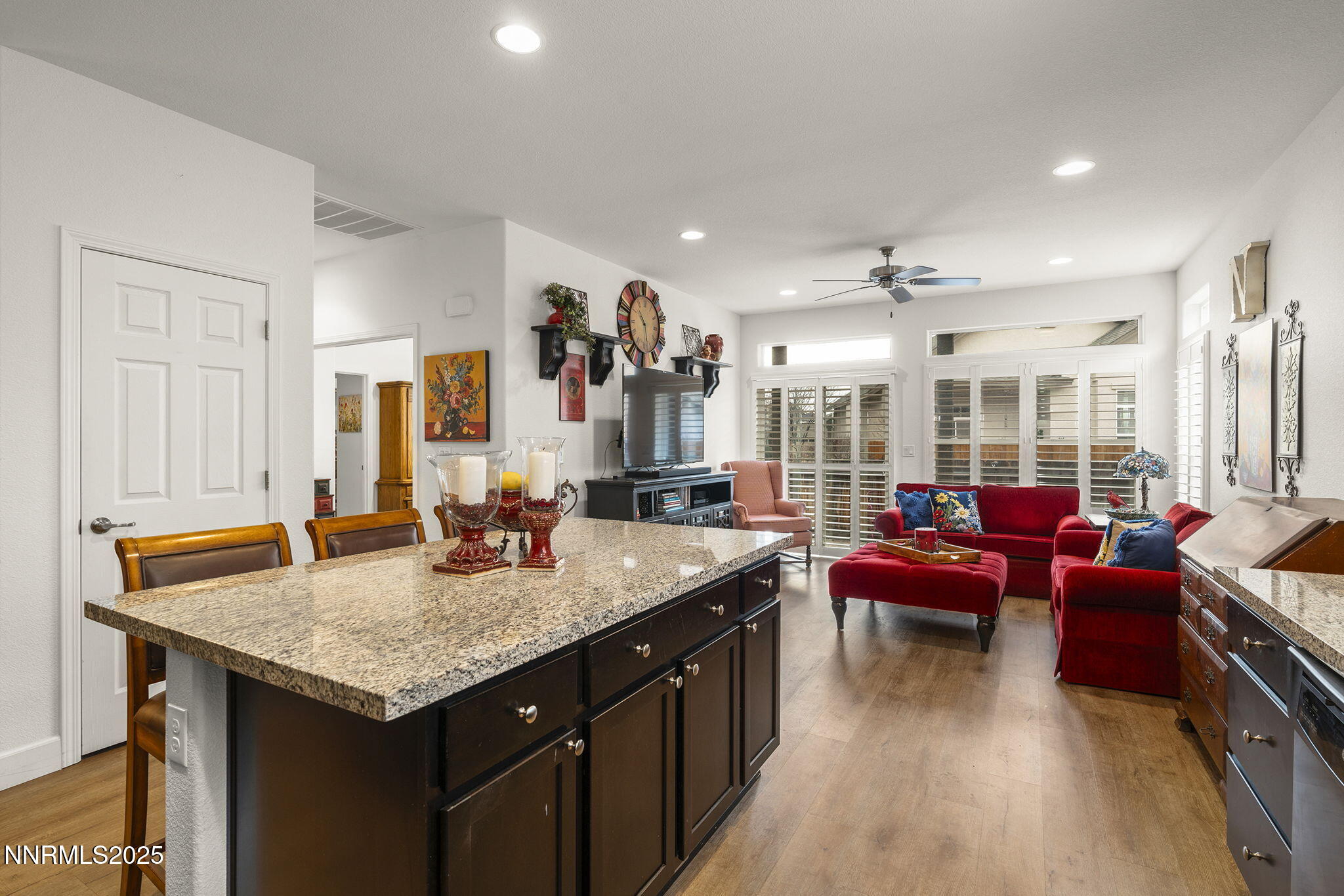 985 Floral Ridge Way Sparks, NV 89436 - Photo 11 of 24 a kitchen with granite countertop kitchen island stainless steel appliances a sink and living room view