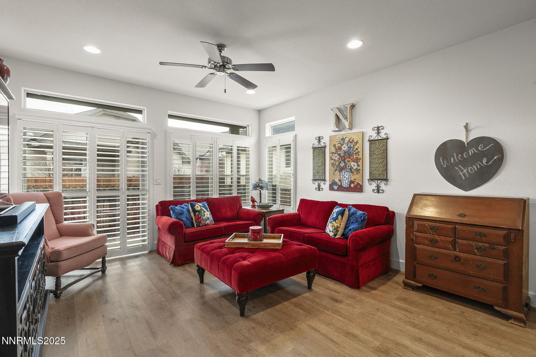 985 Floral Ridge Way Sparks, NV 89436 - Photo 12 of 24 a living room with furniture a flat screen tv and a large window