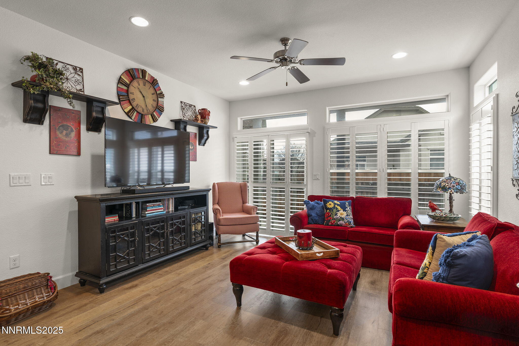 985 Floral Ridge Way Sparks, NV 89436 - Photo 13 of 24 a living room with furniture cabinets and a flat screen tv