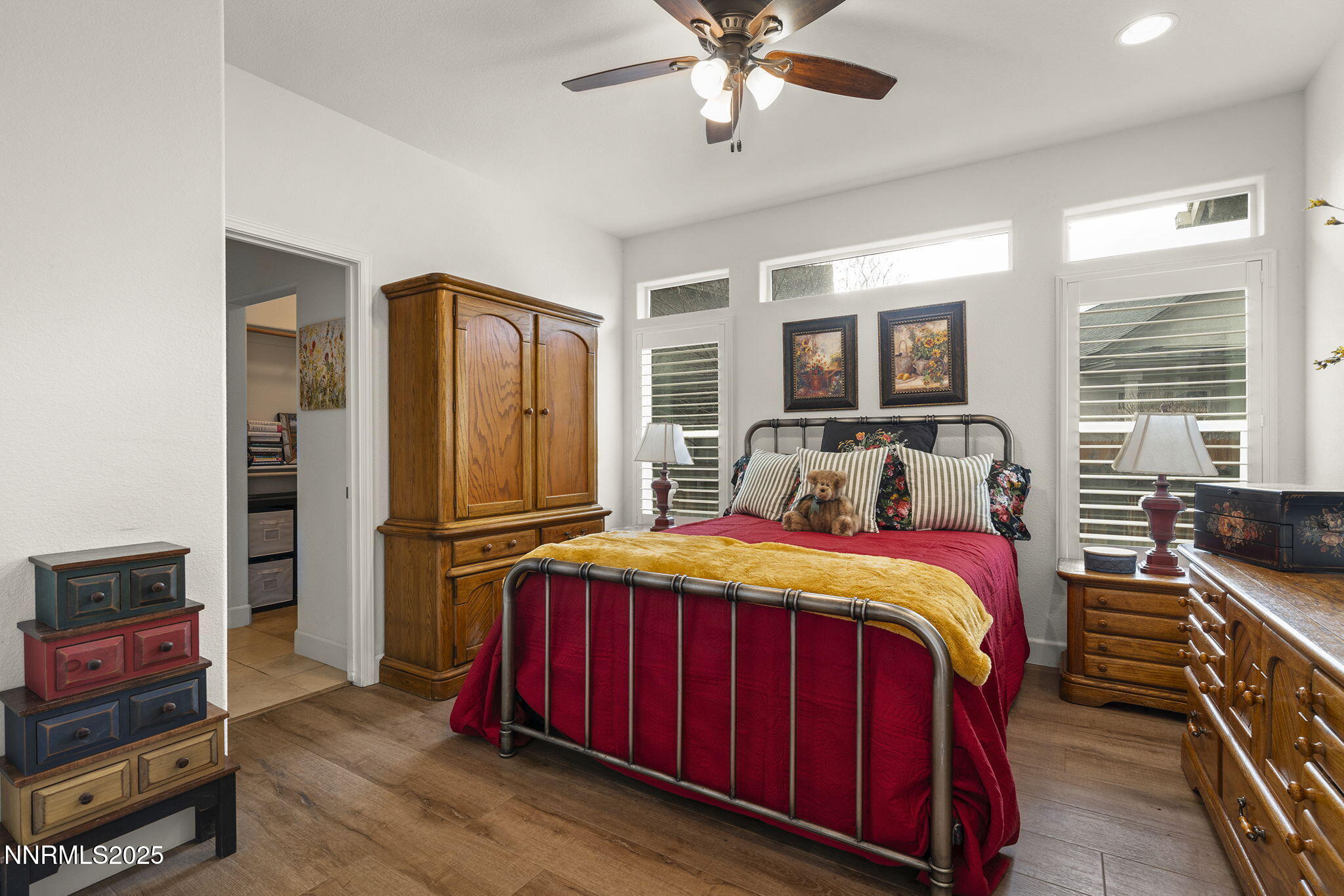 985 Floral Ridge Way Sparks, NV 89436 - Photo 15 of 24 a bedroom with a bed and wooden floor