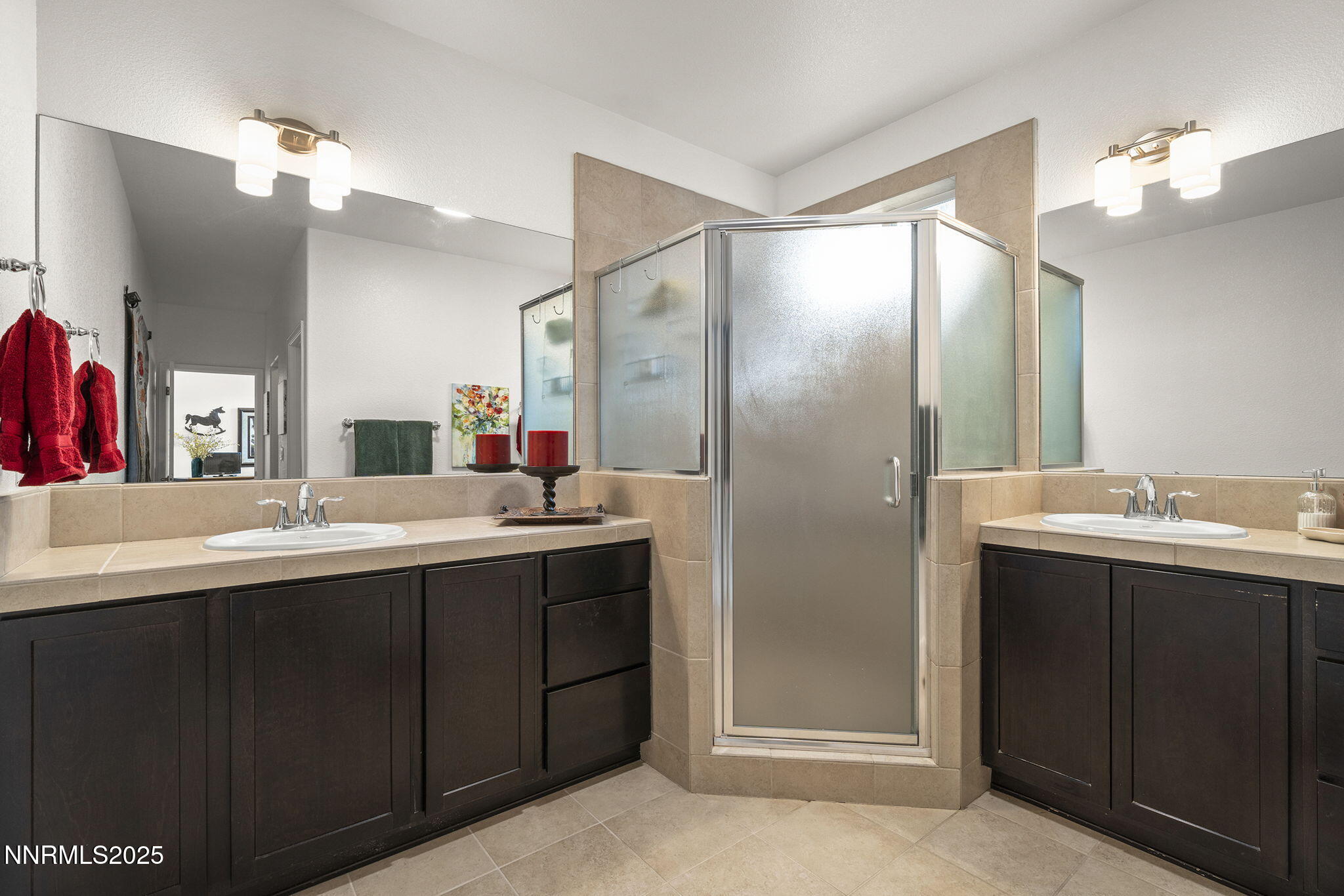 985 Floral Ridge Way Sparks, NV 89436 - Photo 17 of 24 a bathroom with a double vanity sink and a mirror