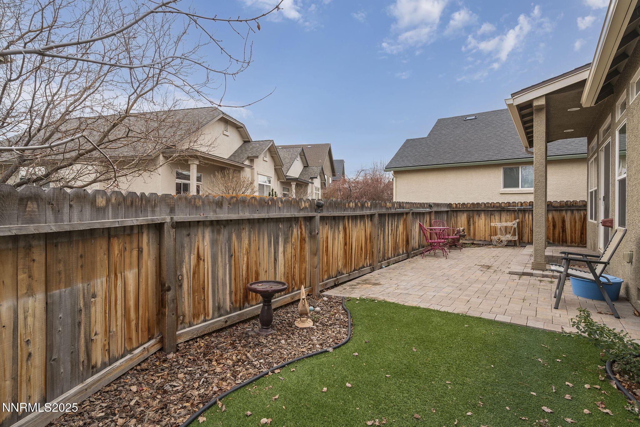 985 Floral Ridge Way Sparks, NV 89436 - Photo 21 of 24 a view of a backyard with wooden fence