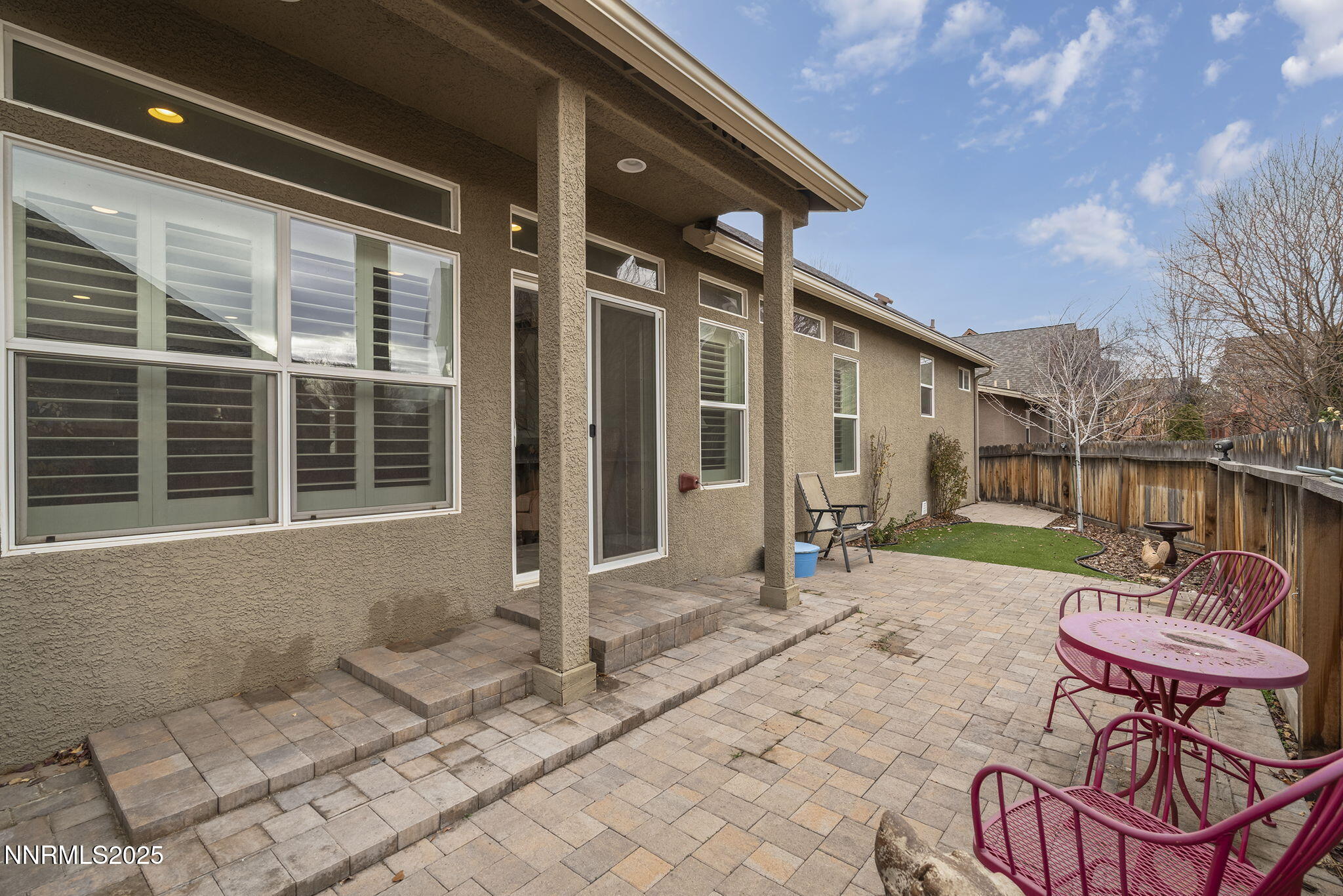985 Floral Ridge Way Sparks, NV 89436 - Photo 23 of 24 a backyard of a house with table and chairs