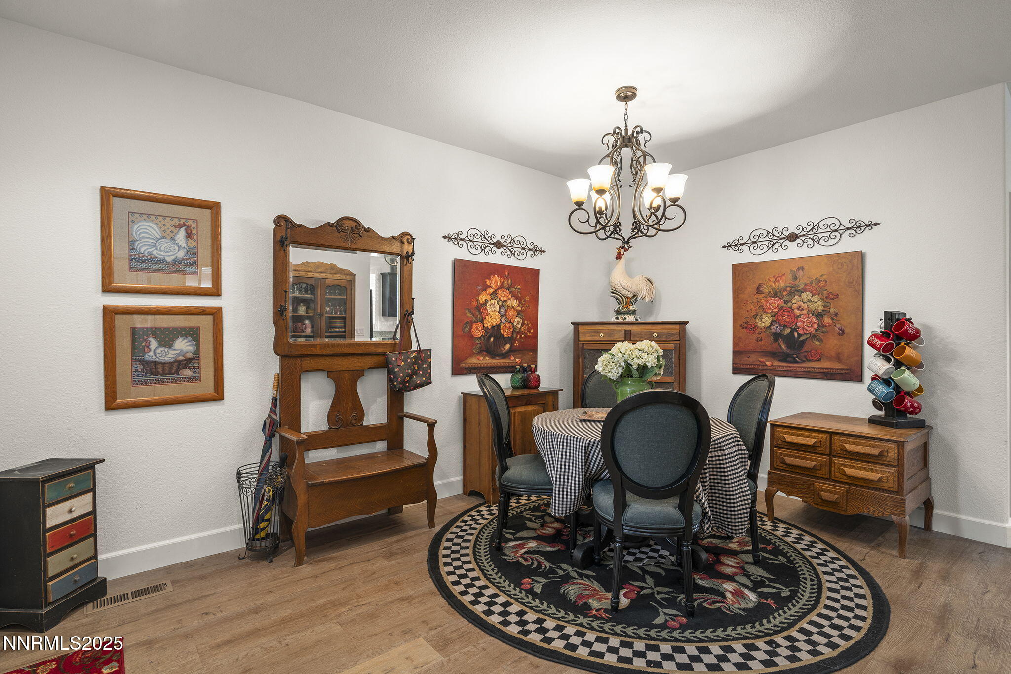 985 Floral Ridge Way Sparks, NV 89436 - Photo 7 of 24 a living room with furniture a chandelier and a rug