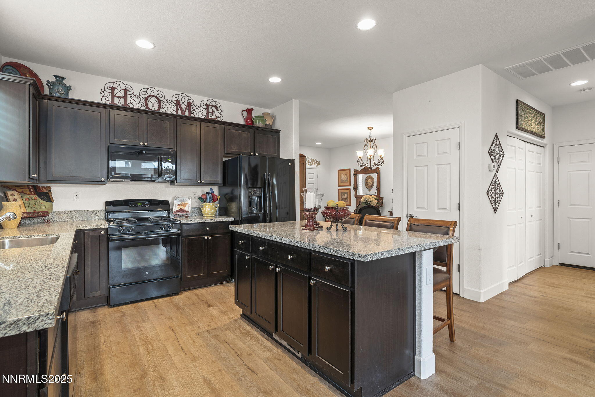 985 Floral Ridge Way Sparks, NV 89436 - Photo 10 of 24 a kitchen with a sink stove and refrigerator