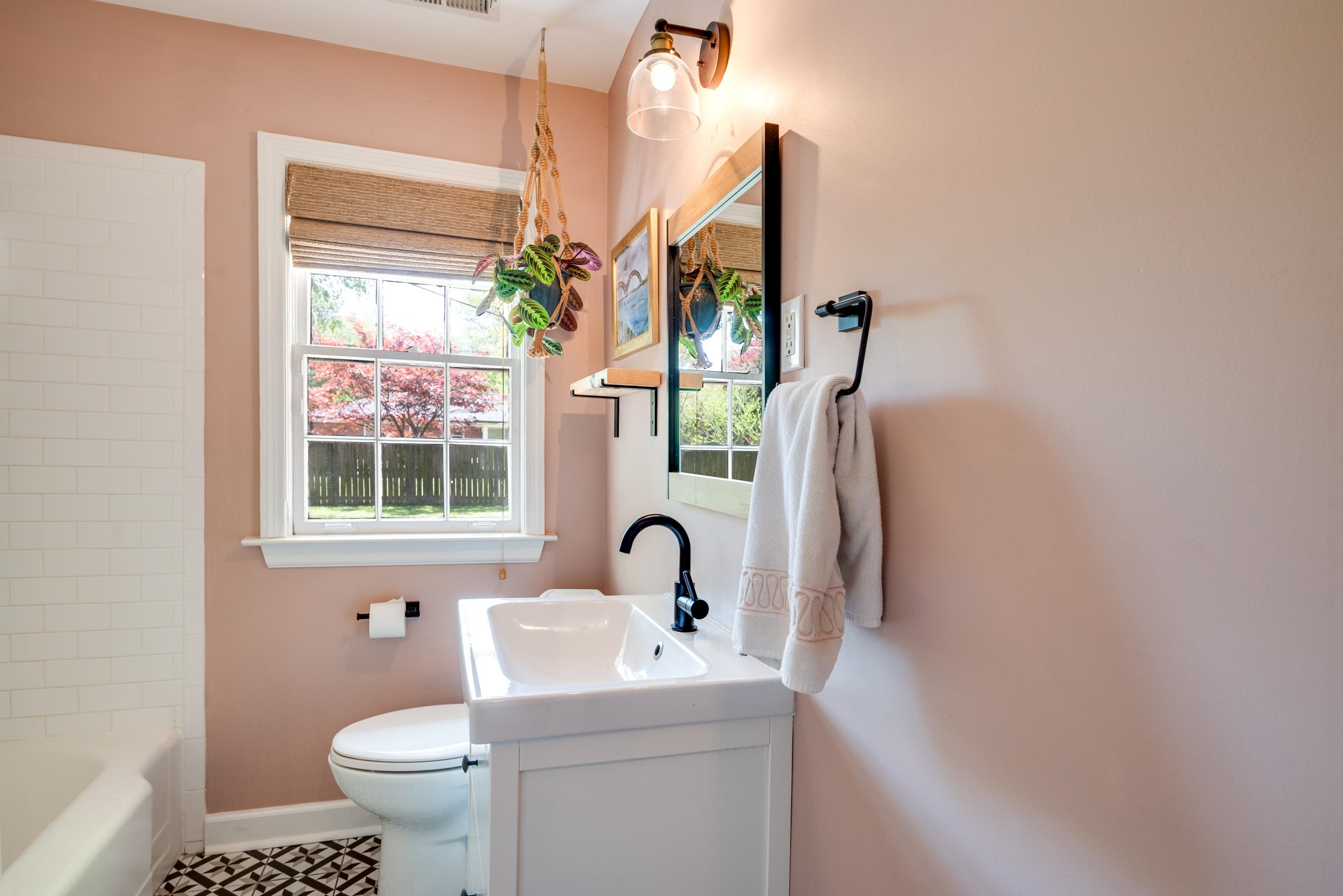 1089 West Perkins Road Memphis, TN 38117 - Photo 19 of 25 a bathroom with a sink toilet and a mirror