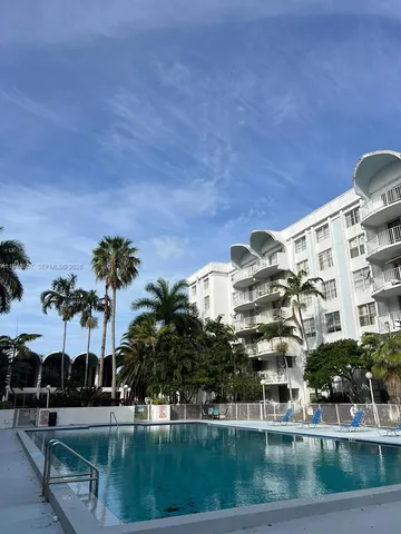 a bathroom with a sink a toilet a mirror and shower
