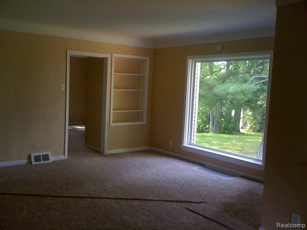 780 Collier Road Auburn Hills, MI 48326 - Photo 4 of 12 Open living room w builtins.JPG