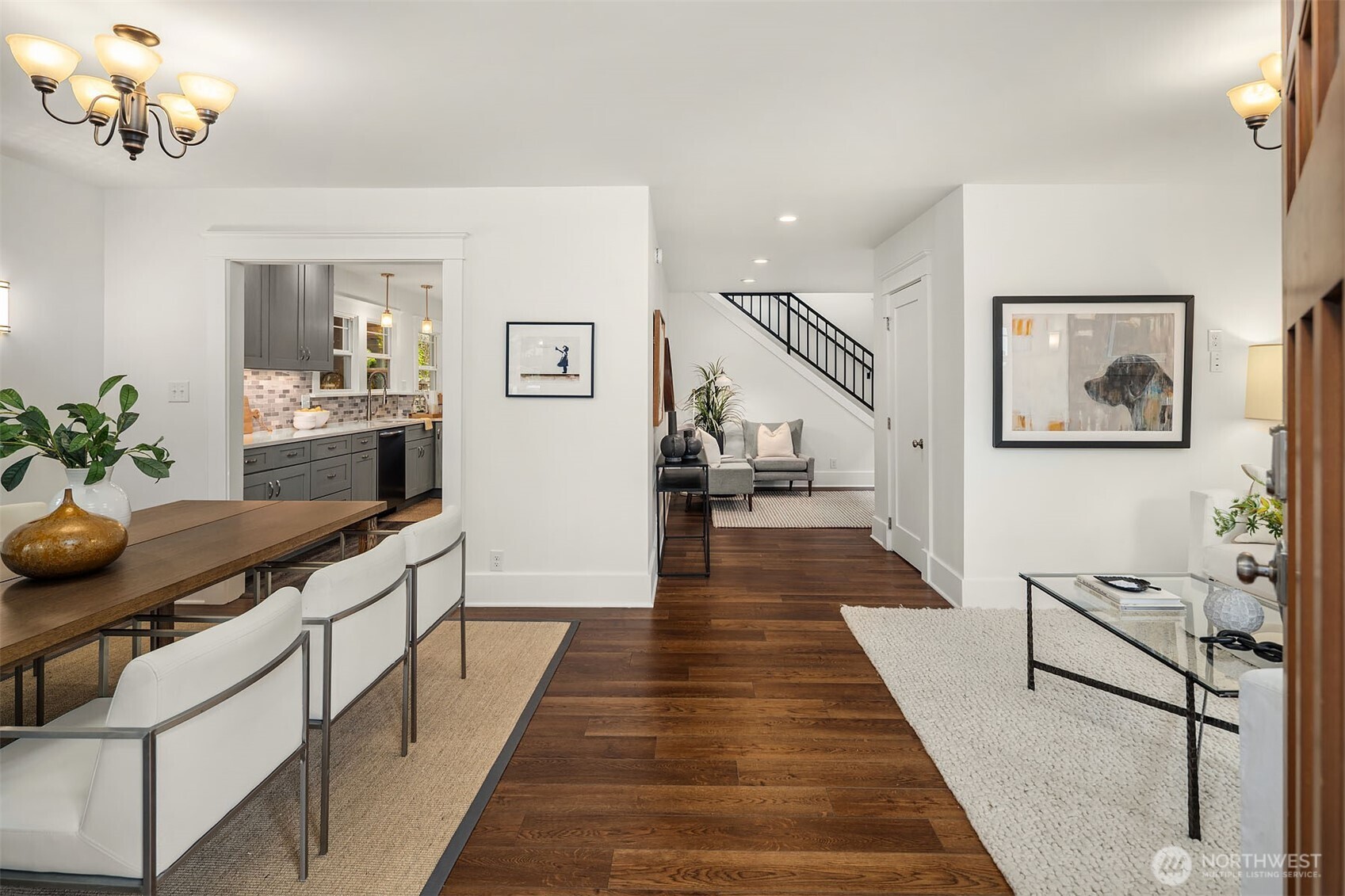 519 27th Avenue Seattle, WA 98122 - Photo 2 of 38 a view of a hallway with wooden floor and furniture