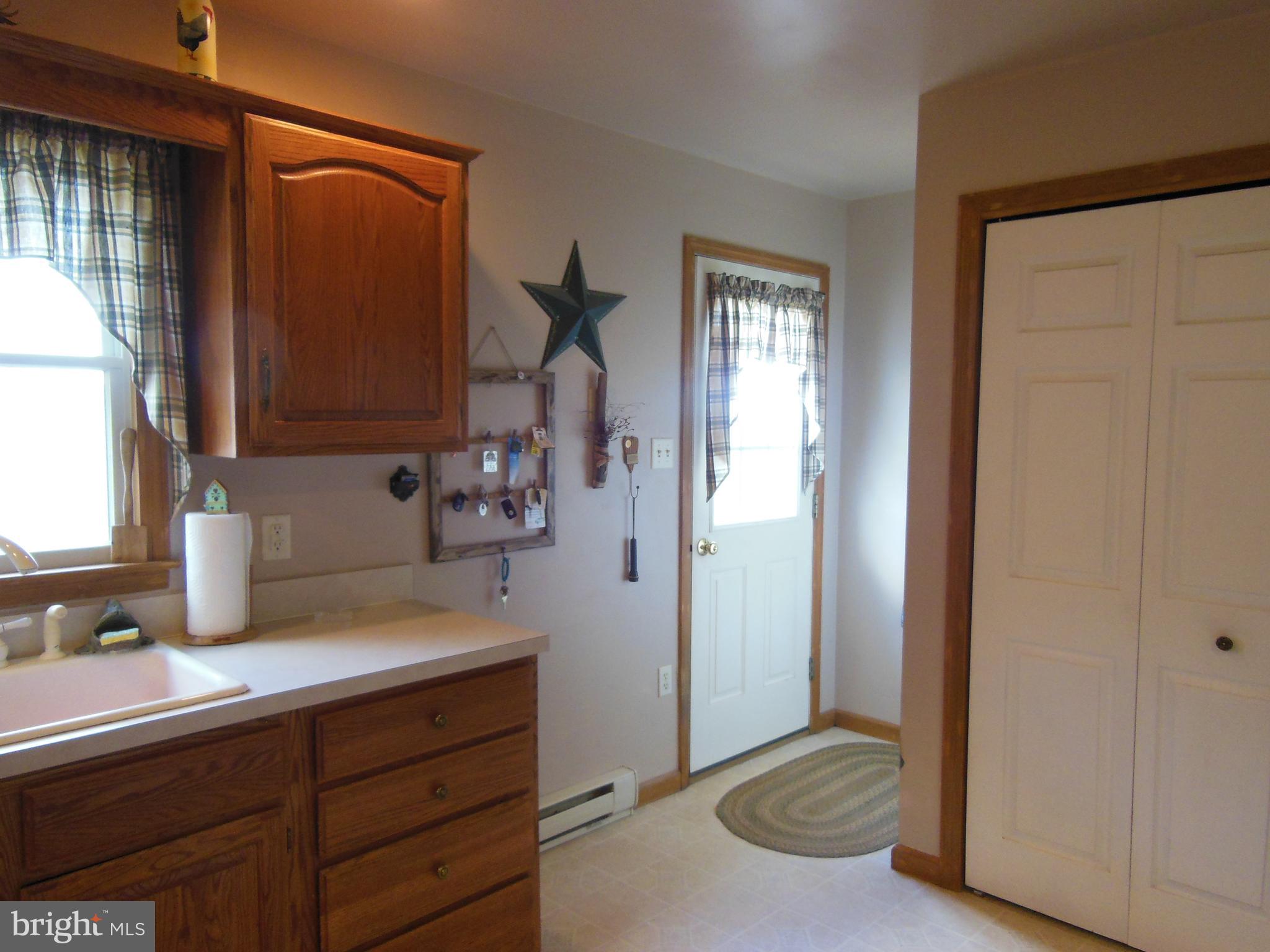 92 Spencers Run Inwood, WV 25428 - Photo 15 of 35 Door to Stoop and Small Patio Area