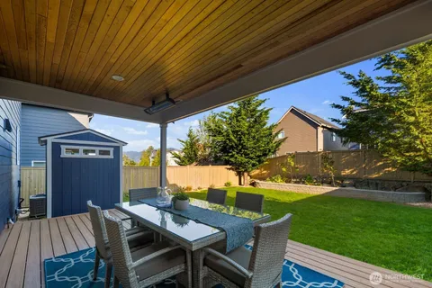 a view of a patio with table and chairs and potted plants