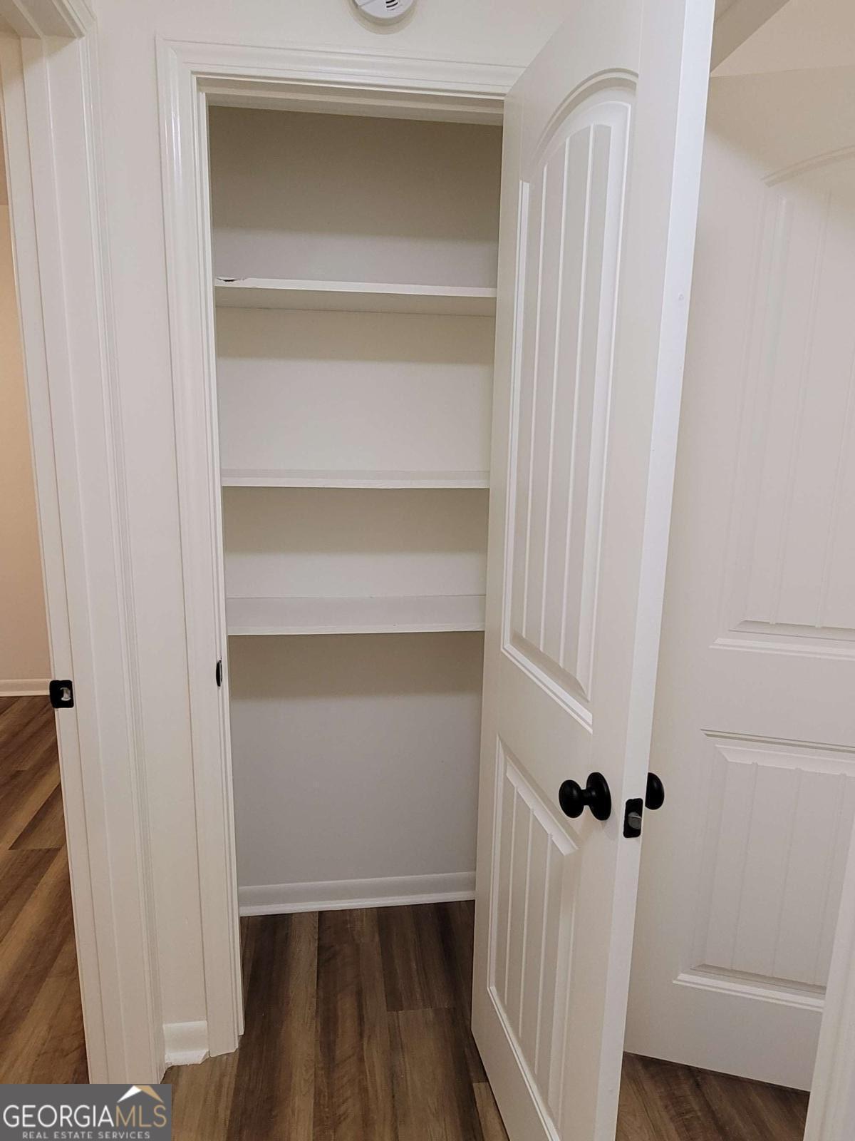 47 West New Street, Unit A Winder, GA 30680 - Photo 15 of 28 a view of a room with wooden floor