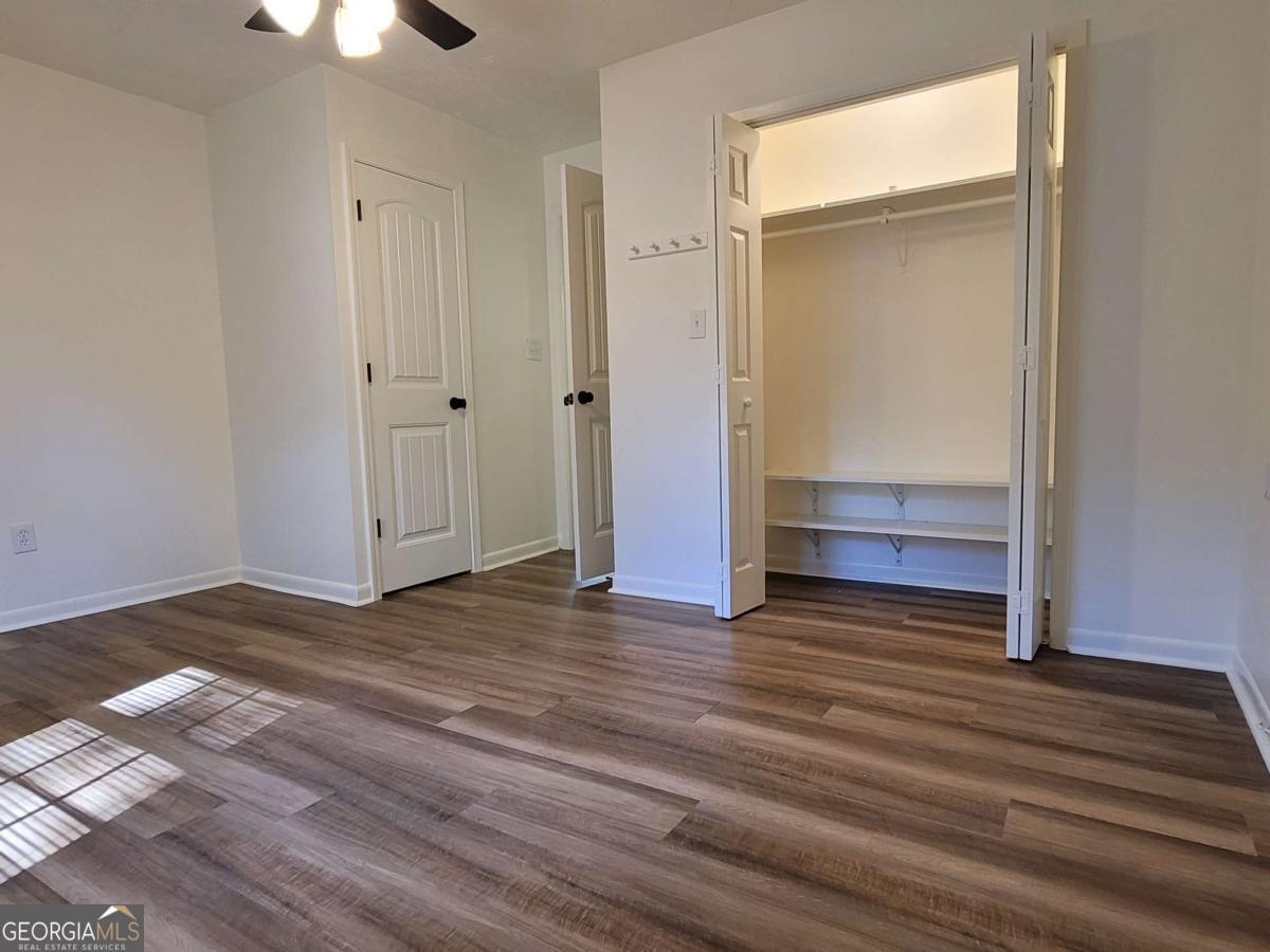 47 West New Street, Unit A Winder, GA 30680 - Photo 19 of 28 a view of empty room with wooden floor