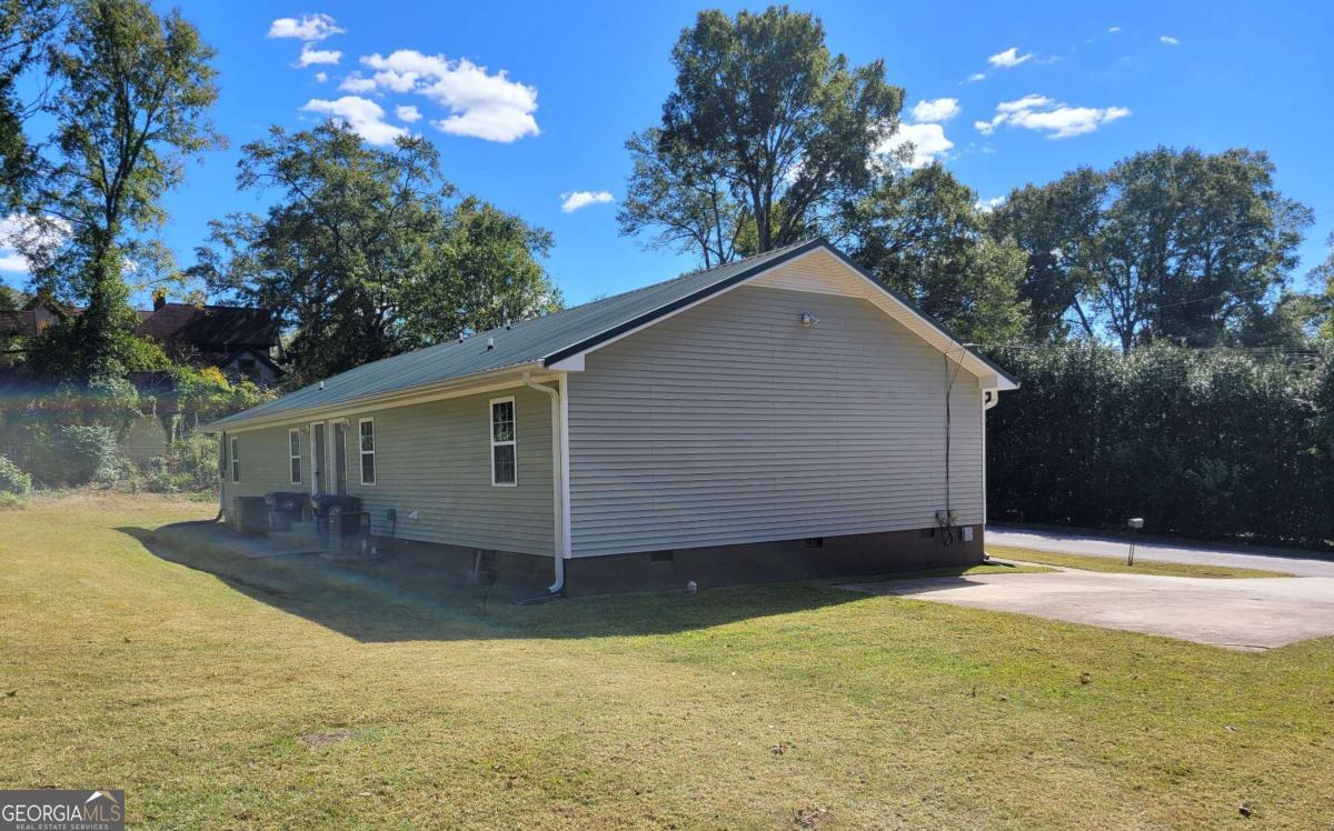 47 West New Street, Unit A Winder, GA 30680 - Photo 2 of 28 a view of a house with a yard