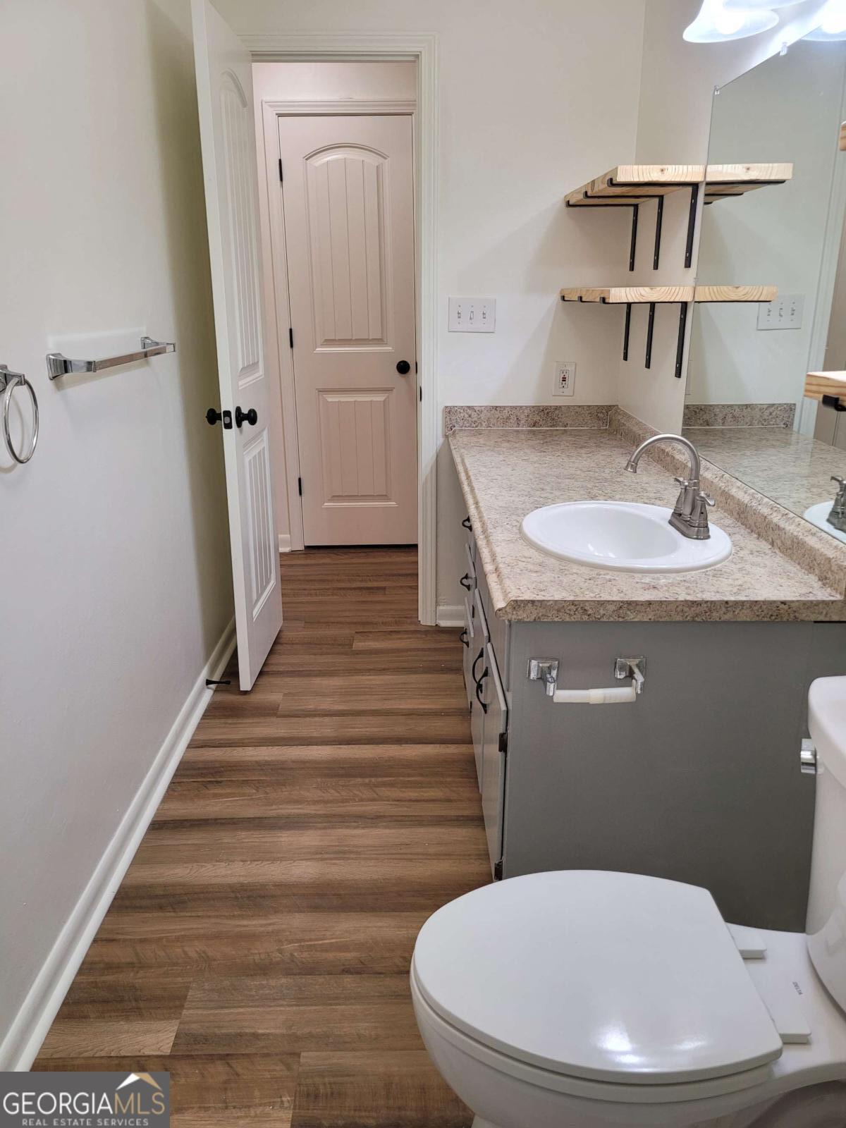47 West New Street, Unit A Winder, GA 30680 - Photo 23 of 28 a bathroom with a sink and toilet