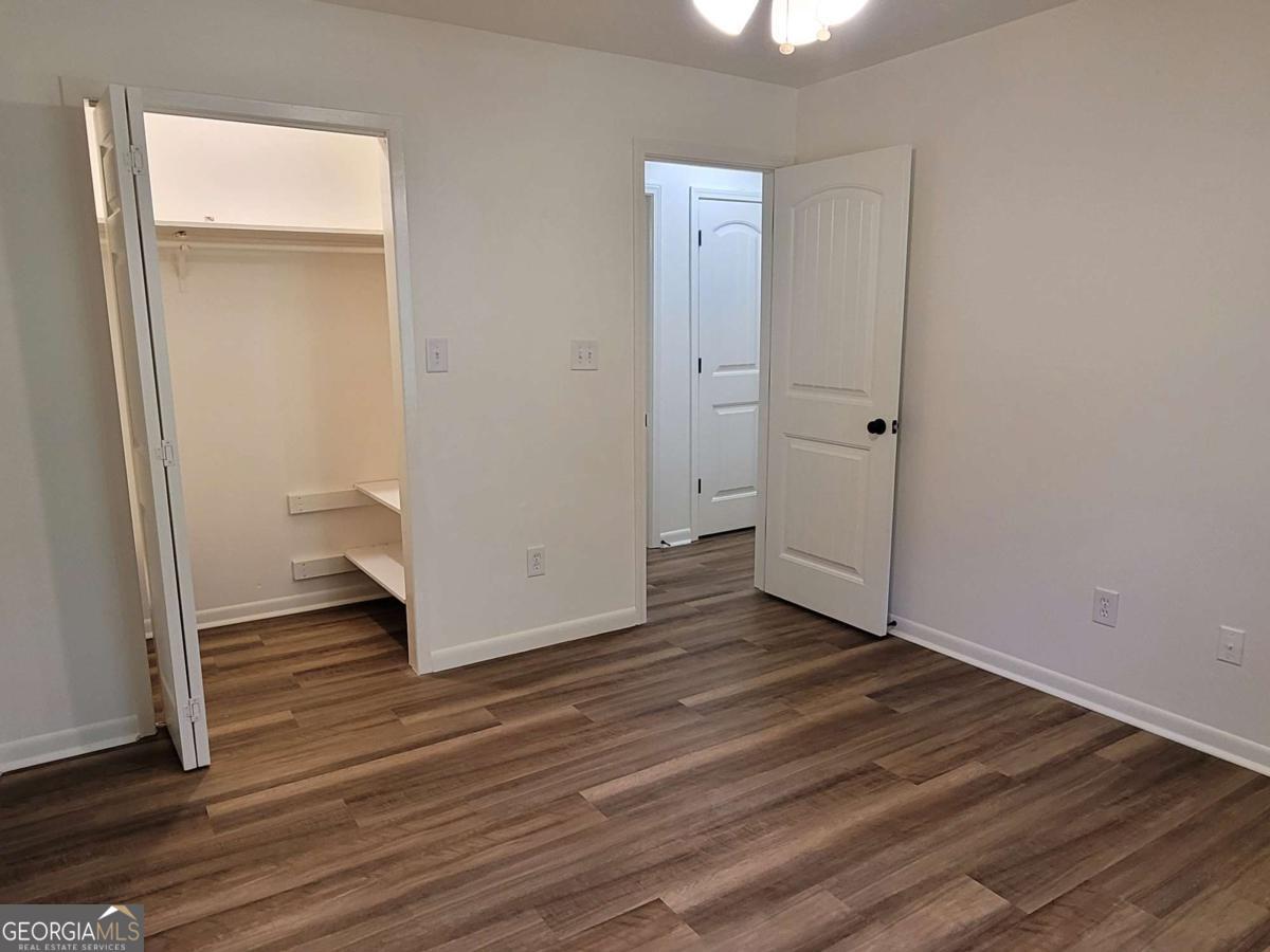 47 West New Street, Unit A Winder, GA 30680 - Photo 26 of 28 a view of empty room with wooden floor