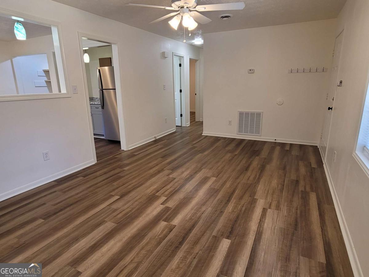 47 West New Street, Unit A Winder, GA 30680 - Photo 5 of 28 a view of a livingroom with wooden floor
