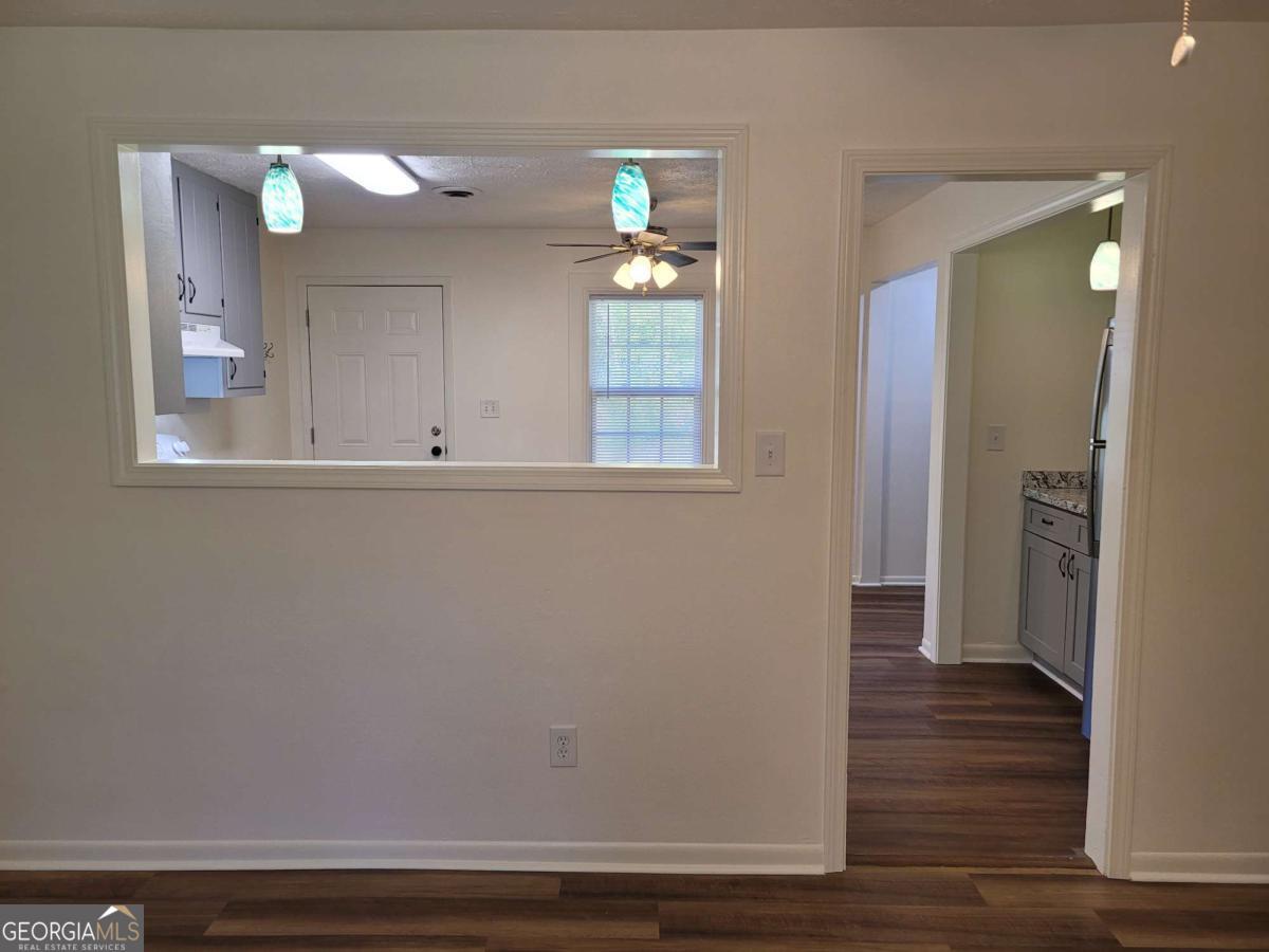 47 West New Street, Unit A Winder, GA 30680 - Photo 9 of 28 a view of empty room with wooden floor