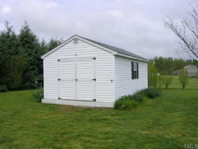 63 Dustin Lane Roxboro, NC 27574 - Photo 3 of 8 a view of a backyard