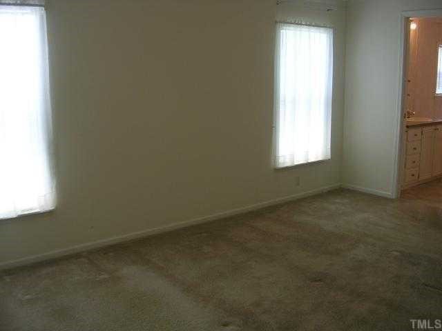 63 Dustin Lane Roxboro, NC 27574 - Photo 6 of 8 an empty room with a window