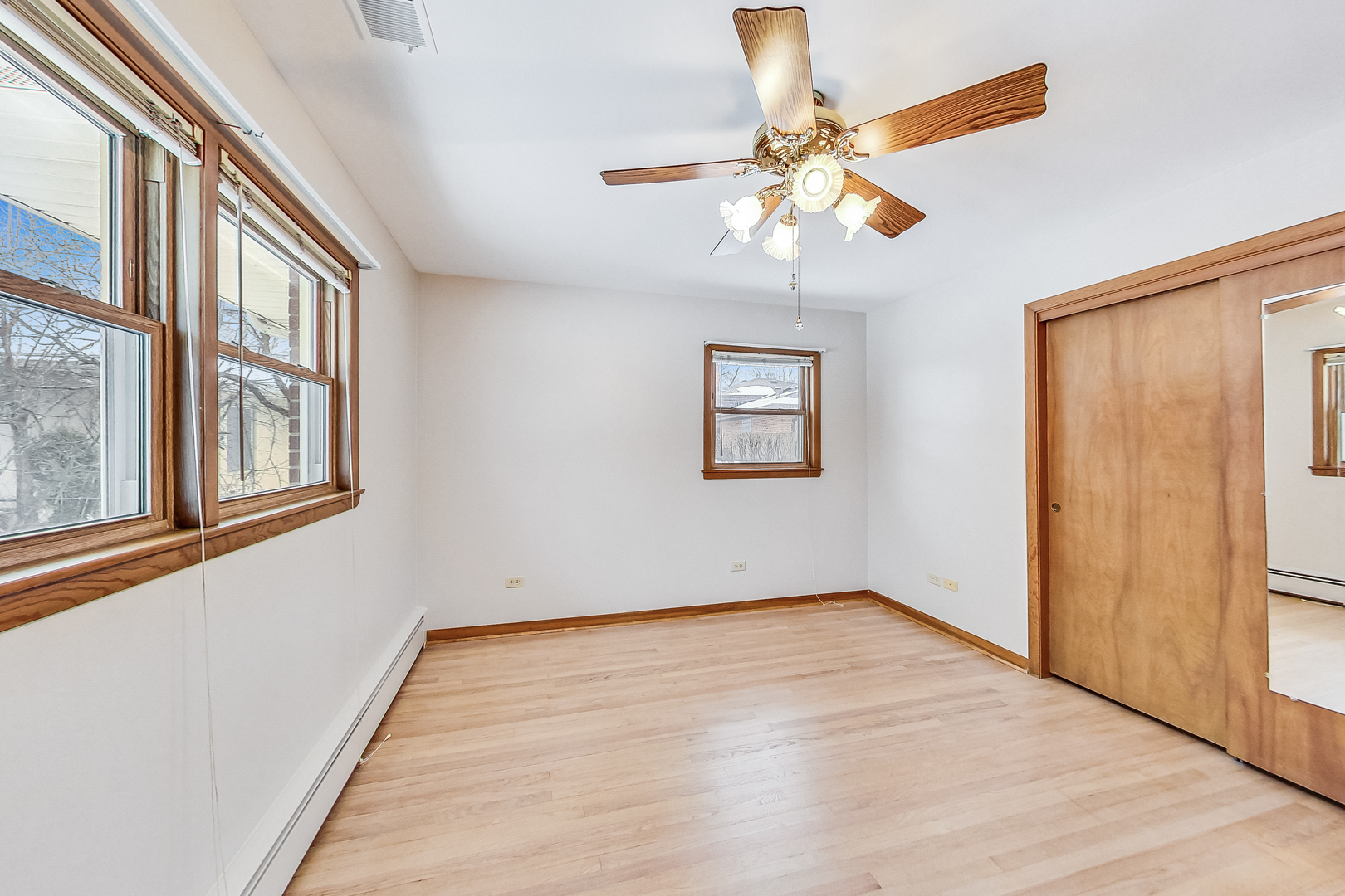 1108 Tyrell Avenue Park Ridge, IL 60068 - Photo 16 of 32 a view of an empty room with wooden floor and a window