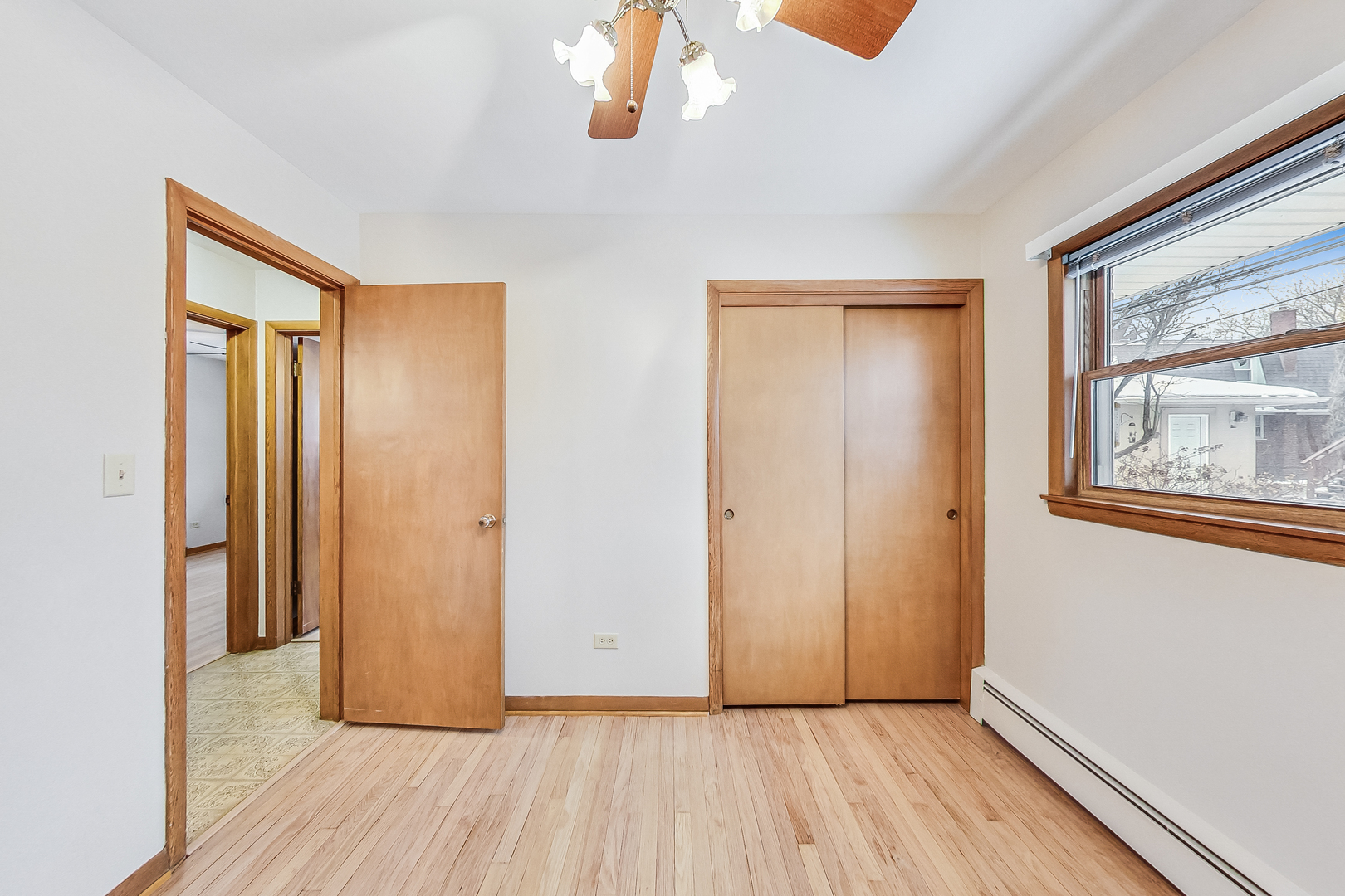 1108 Tyrell Avenue Park Ridge, IL 60068 - Photo 23 of 32 a view of an empty room with wooden floor and a window