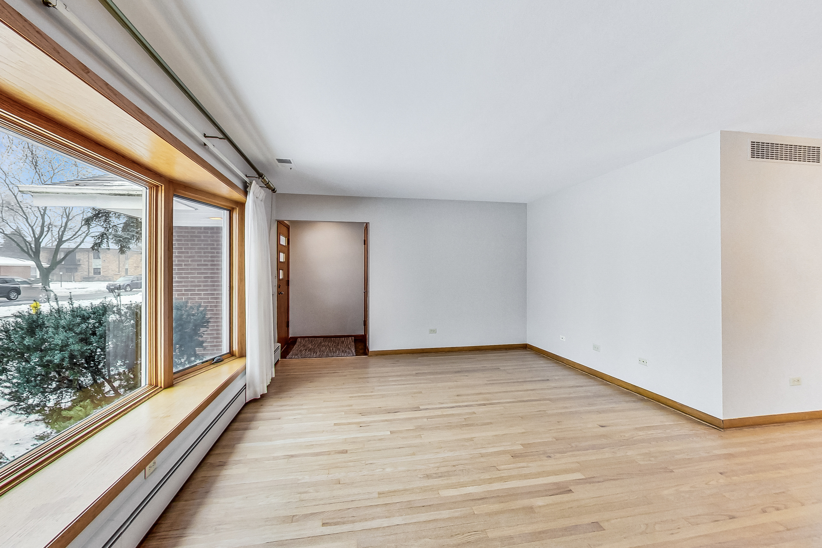 1108 Tyrell Avenue Park Ridge, IL 60068 - Photo 3 of 32 a view of a big room with wooden floor and windows