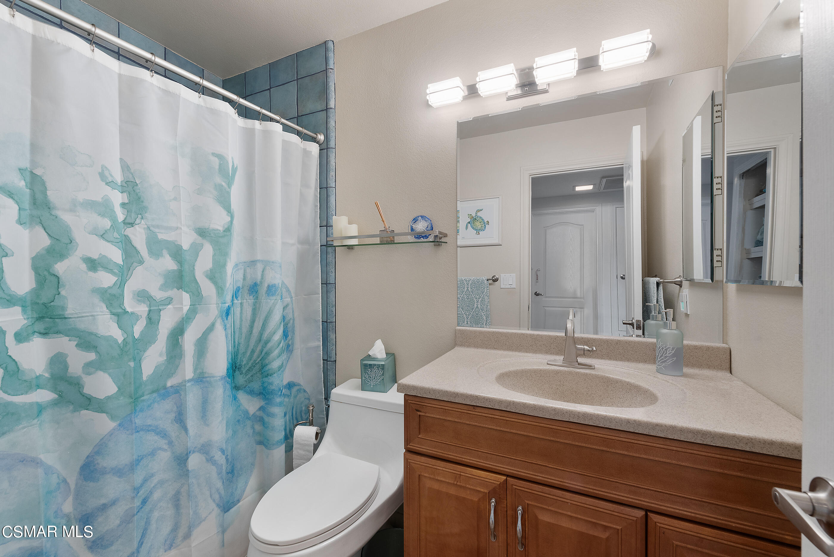1037 Roldan Avenue Simi Valley, CA 93065 - Photo 22 of 32 a bathroom with a sink toilet and shower