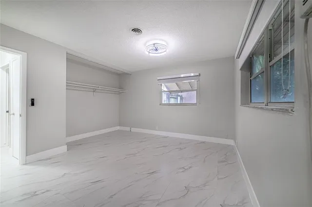 a bathroom with a toilet and bathtub