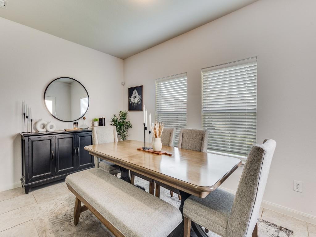 157 Lamont Road Anna, TX 75409 - Photo 14 of 31 a view of a dining room with a table and chairs