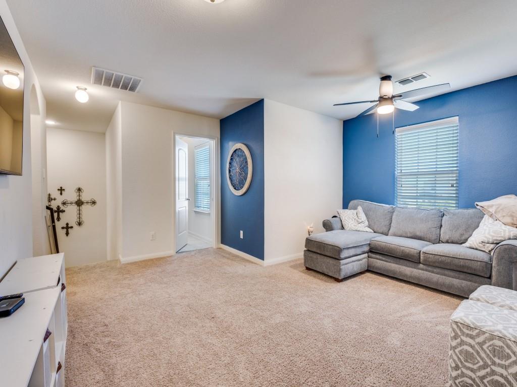 157 Lamont Road Anna, TX 75409 - Photo 15 of 31 a living room with furniture a window and a chandelier