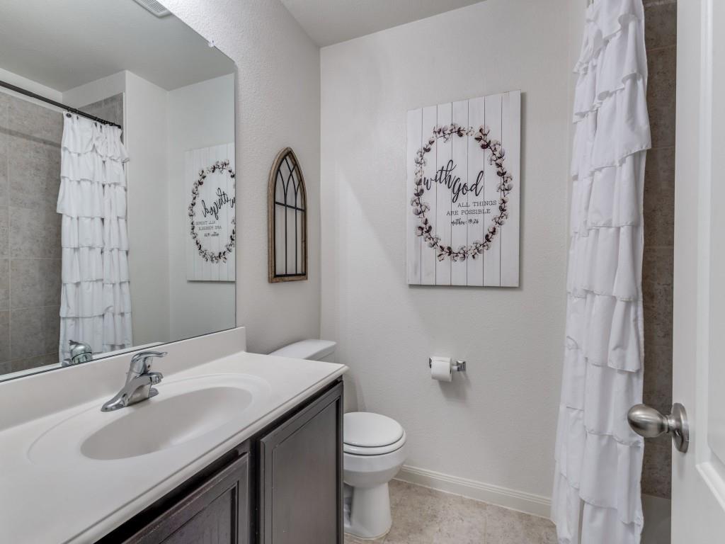 157 Lamont Road Anna, TX 75409 - Photo 22 of 31 a bathroom with a toilet sink and mirror