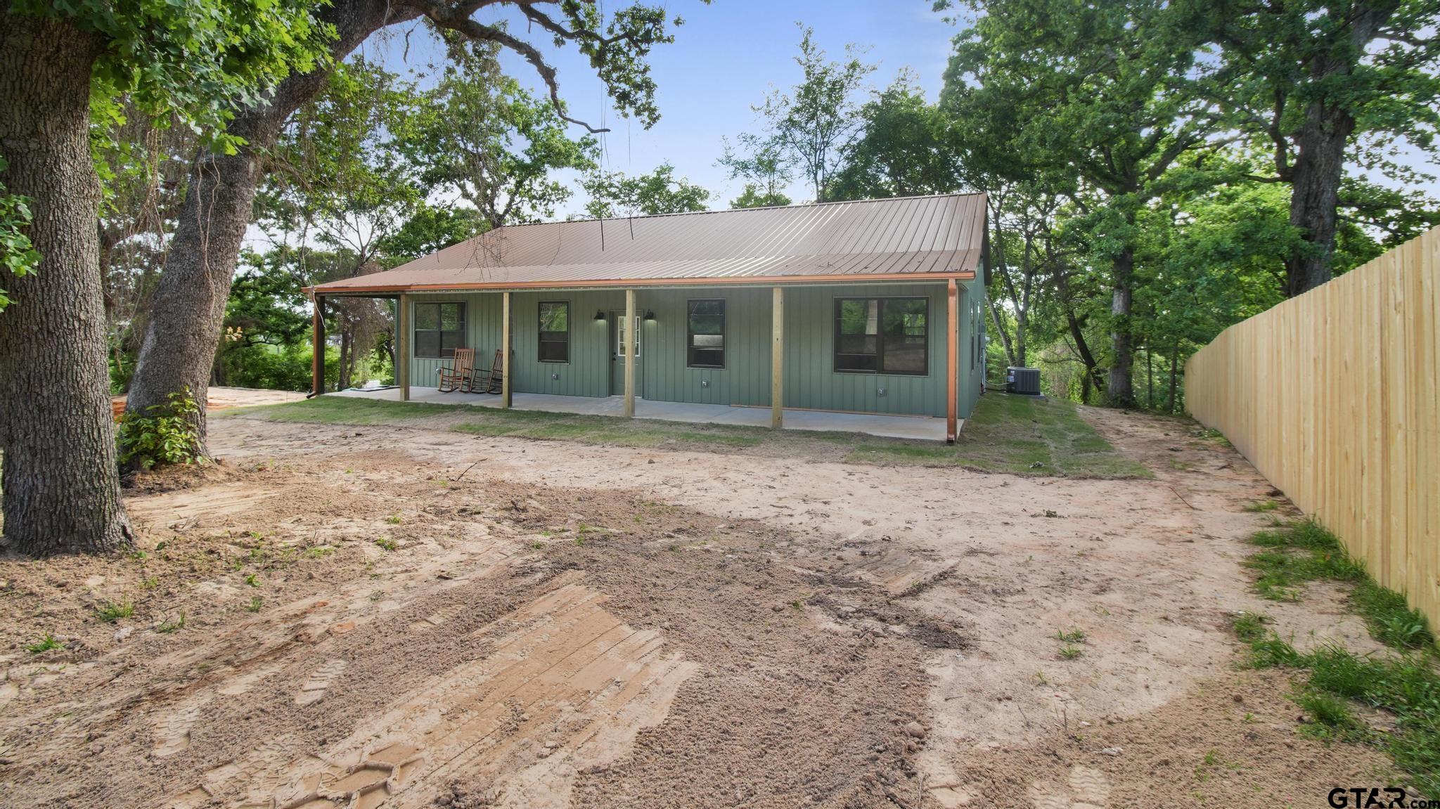 22522 Pine Street Flint, TX 75762 - Photo 1 of 39 a front view of a house with garden