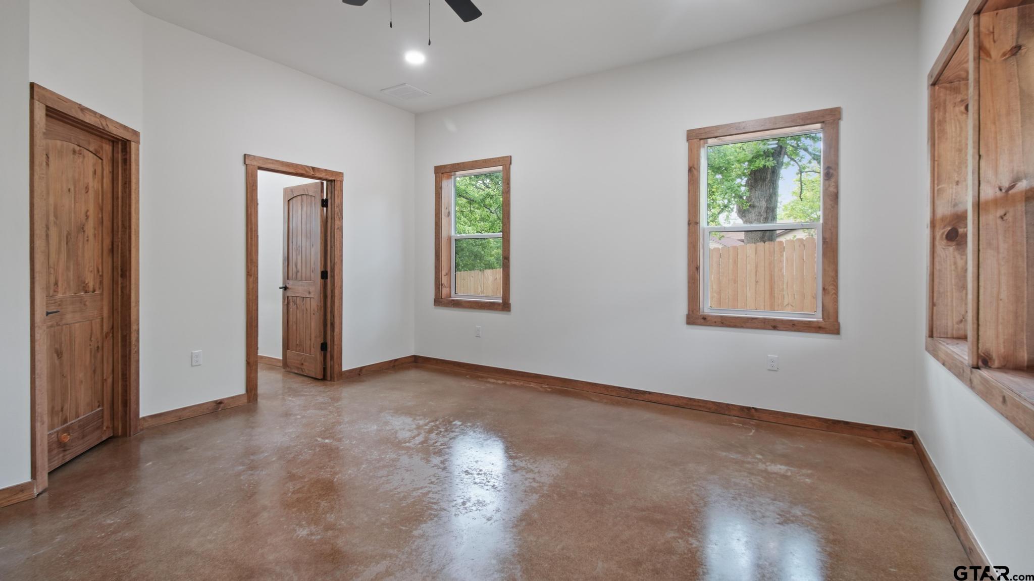 22522 Pine Street Flint, TX 75762 - Photo 14 of 39 an empty room with windows