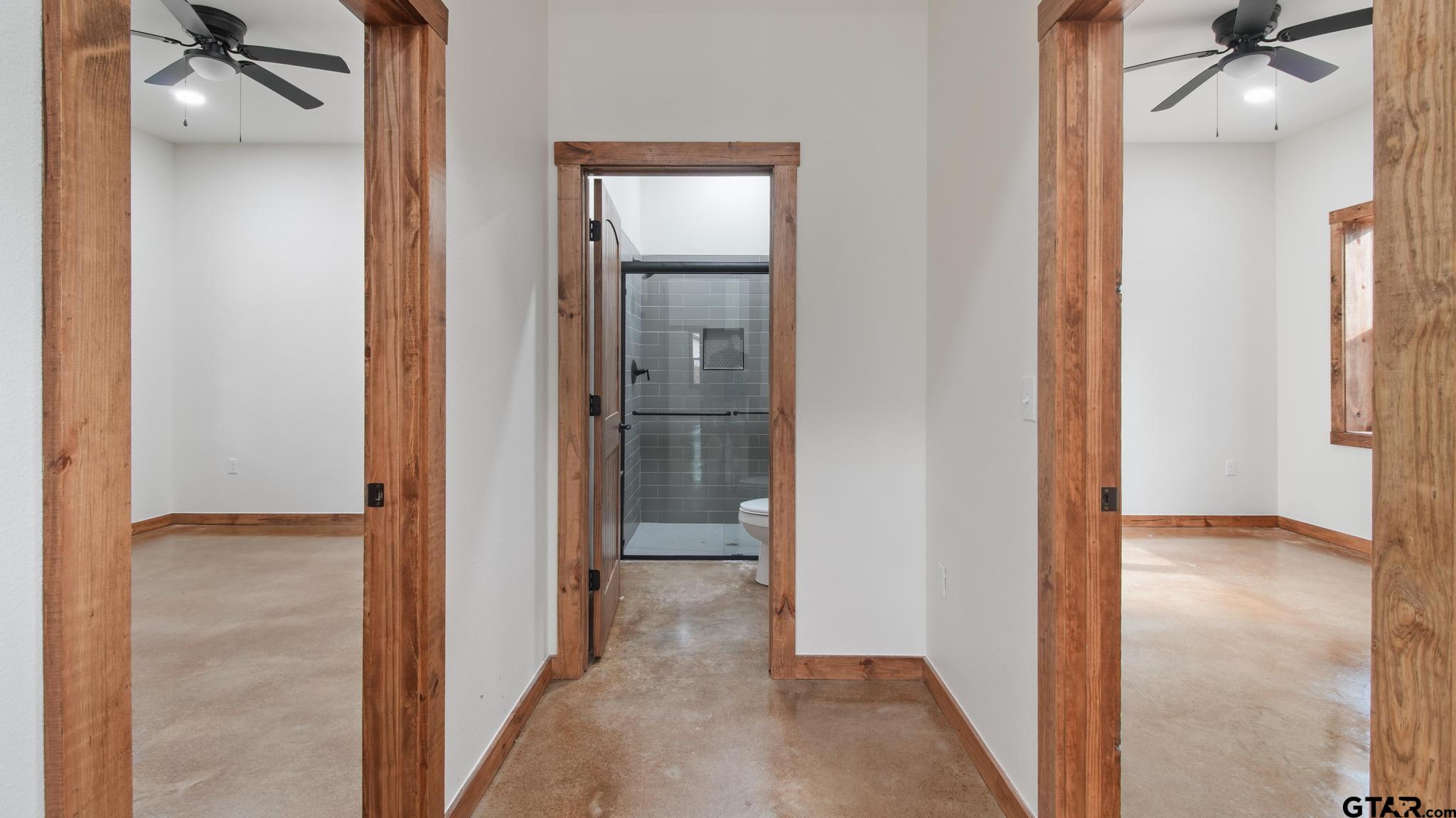 22522 Pine Street Flint, TX 75762 - Photo 23 of 39 a view of a hallway with wooden floor