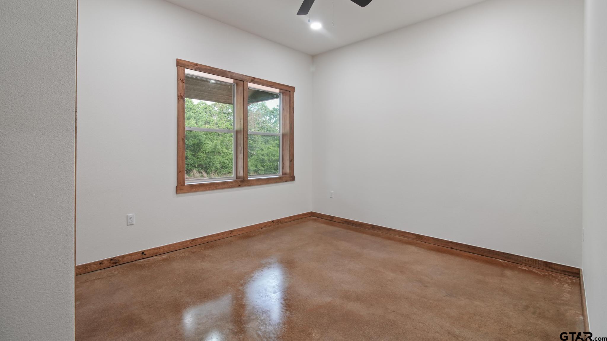 22522 Pine Street Flint, TX 75762 - Photo 26 of 39 an empty room with windows and closet