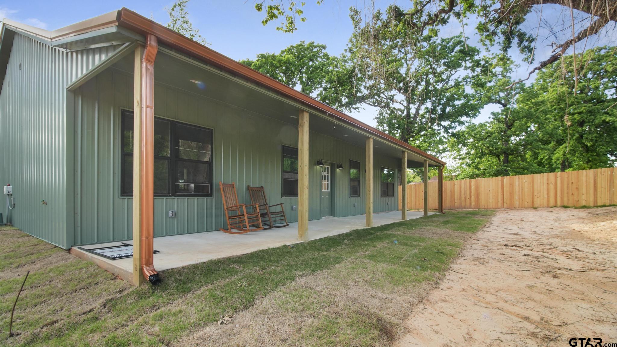 22522 Pine Street Flint, TX 75762 - Photo 4 of 39 a view of a back yard of the house