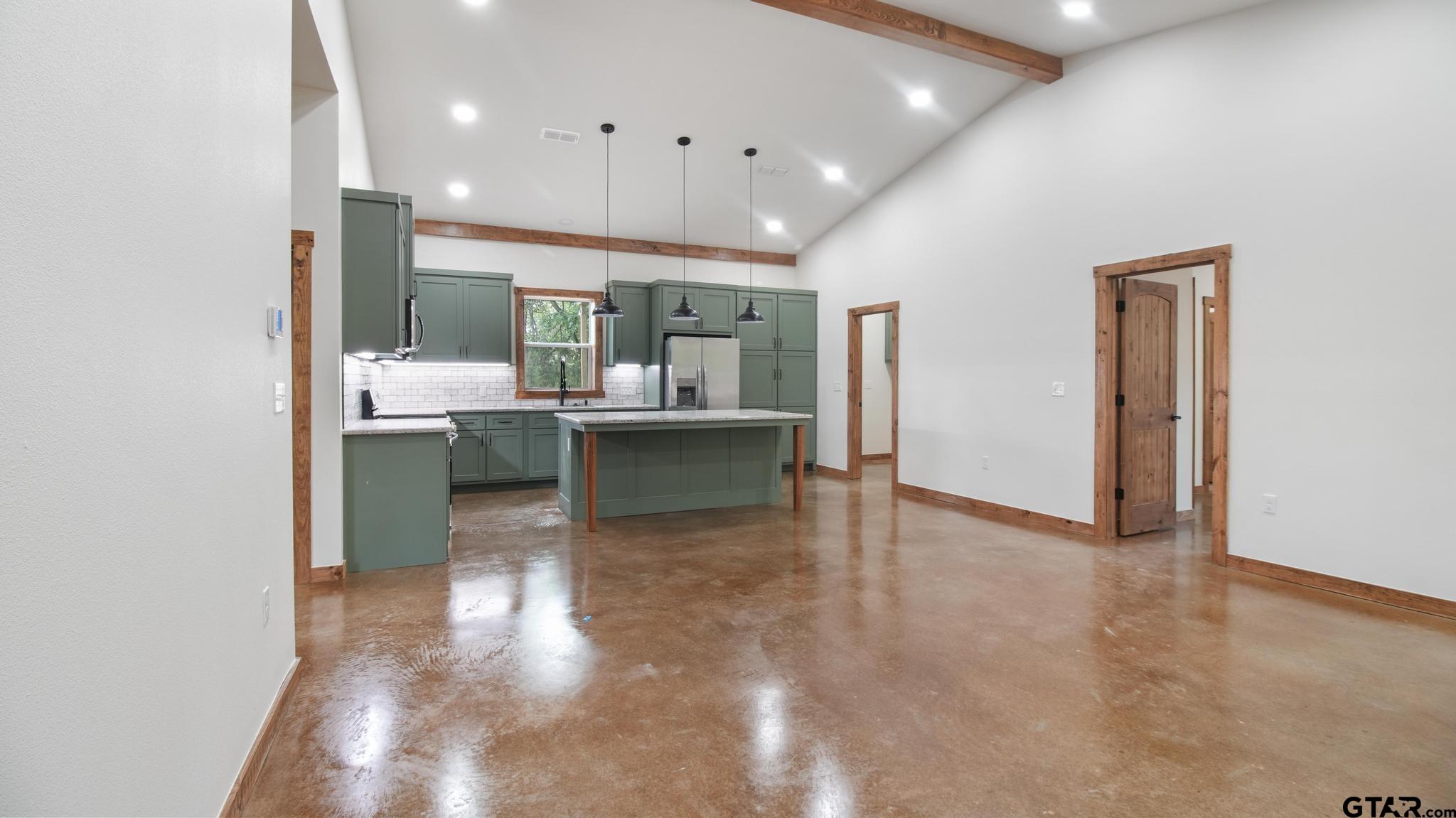 22522 Pine Street Flint, TX 75762 - Photo 5 of 39 a view of kitchen and living room