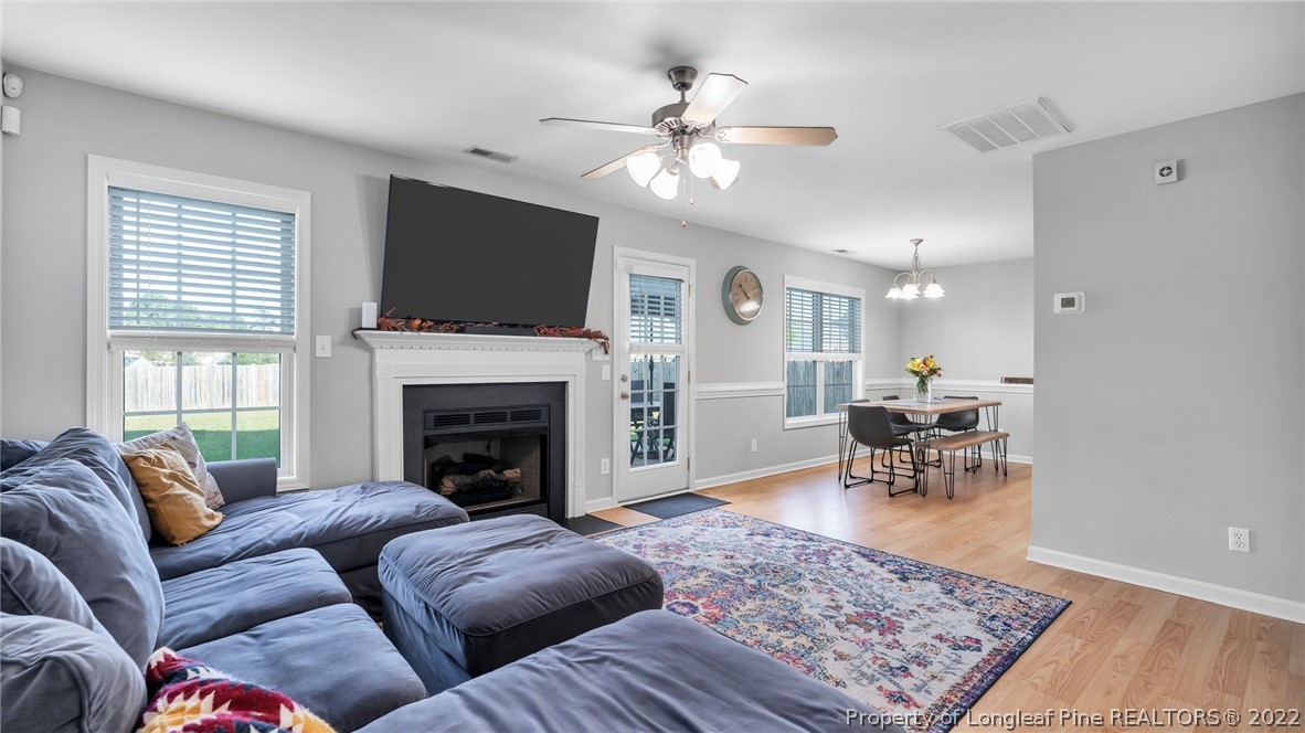 1913 Jenny Road Fayetteville, NC 28314 - Photo 12 of 38 a living room with furniture or flat screen tv and a fireplace