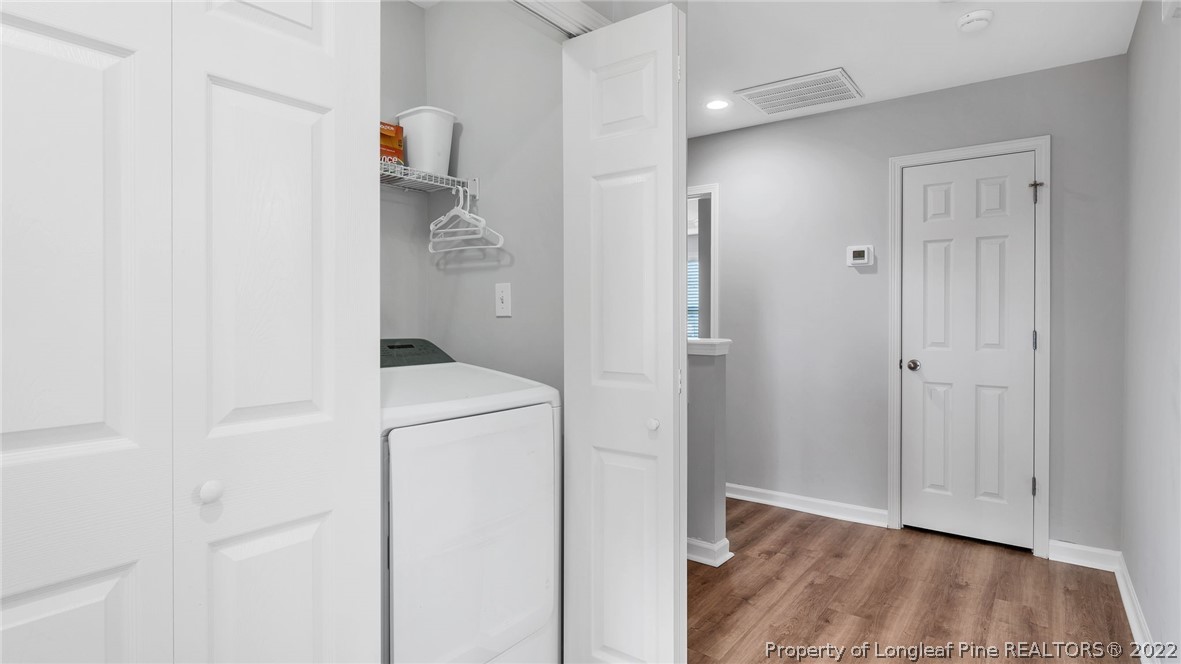 1913 Jenny Road Fayetteville, NC 28314 - Photo 27 of 38 a walk in closet with wooden floor