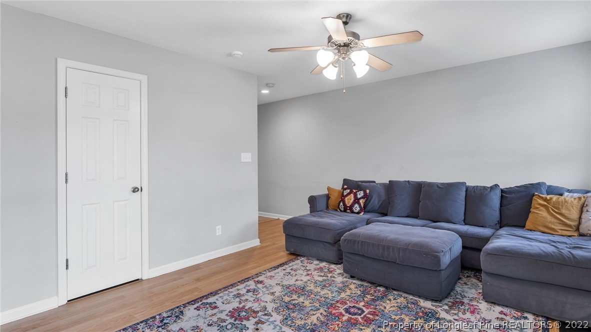 1913 Jenny Road Fayetteville, NC 28314 - Photo 10 of 38 a living room with furniture and a chandelier