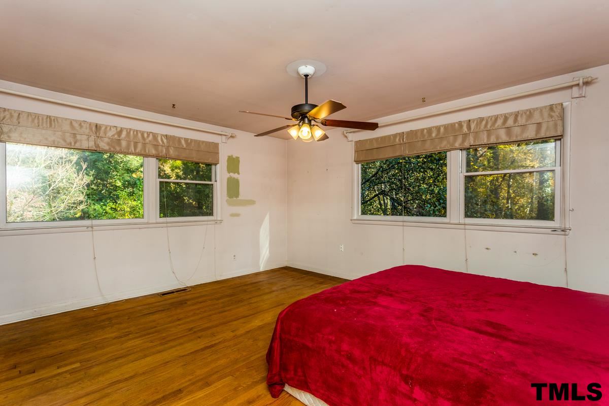 114 Longview Lake Drive Raleigh, NC 27610 - Photo 12 of 25 a bedroom with a bed and a window