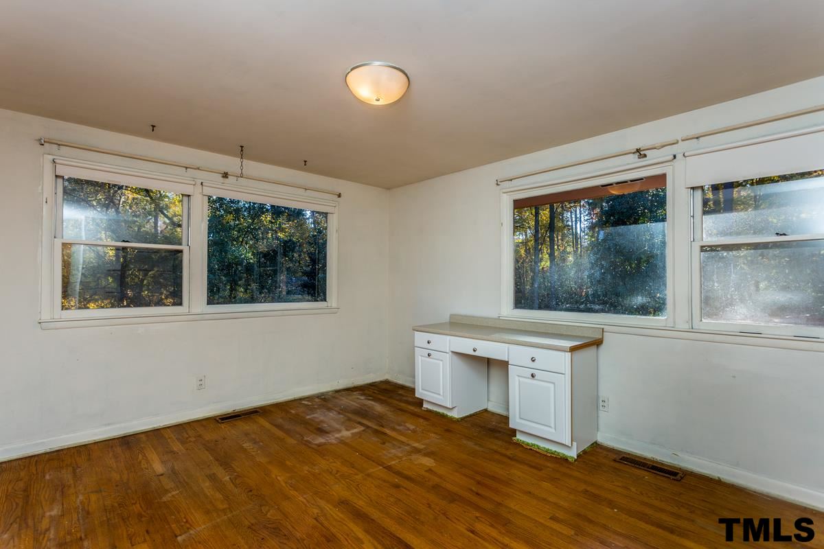 114 Longview Lake Drive Raleigh, NC 27610 - Photo 14 of 25 a workspace with wooden floor and a window