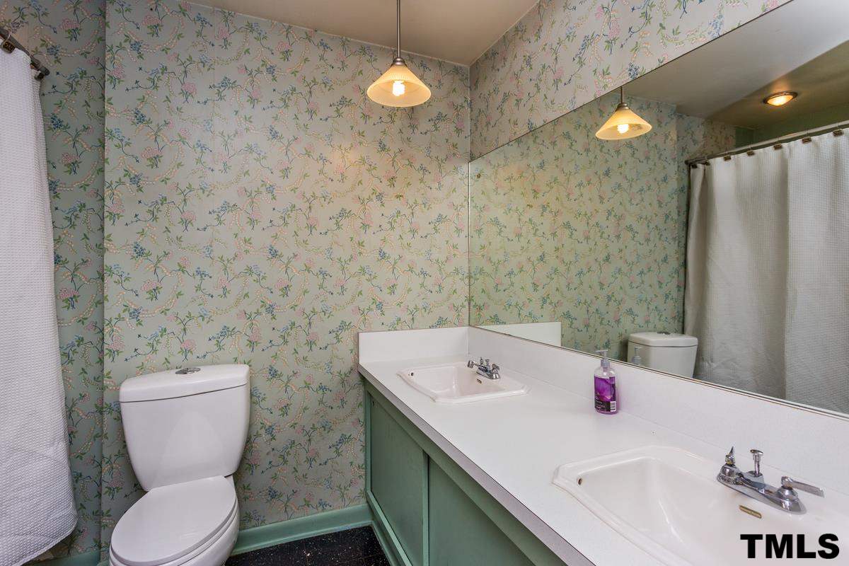 114 Longview Lake Drive Raleigh, NC 27610 - Photo 15 of 25 a bathroom with a sink a toilet and shower